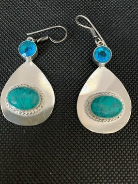 Blue topaz and turquoise together set in .925 silver. Light weight